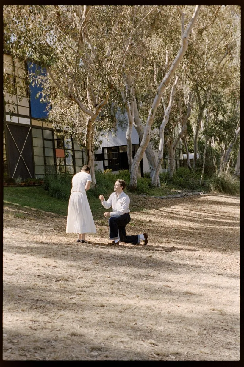 Ian on one knee proposing at the Eames House
